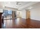 Open-concept living space featuring hardwood floors, large windows, and neutral color palette at 2881 Peachtree Ne Rd # 704, Atlanta, GA 30305