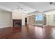 Elegant living room with hardwood floors, a fireplace, and access to a large outdoor terrace at 2881 Peachtree Ne Rd # 704, Atlanta, GA 30305