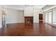 Spacious living area with a cozy fireplace, hardwood floors, and access to an outdoor terrace at 2881 Peachtree Ne Rd # 704, Atlanta, GA 30305