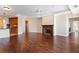 Cozy living room with hardwood floors, a warm fireplace, and natural light at 2881 Peachtree Ne Rd # 704, Atlanta, GA 30305