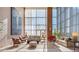 Comfortable lobby with stylish furniture, art, and tall windows, offering a sophisticated and welcoming atmosphere at 2881 Peachtree Ne Rd # 704, Atlanta, GA 30305