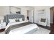 Cozy main bedroom with a tufted headboard, soft lighting, and a serene atmosphere at 2881 Peachtree Ne Rd # 704, Atlanta, GA 30305