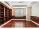 Spacious office includes custom built-in bookshelves and plantation shutters for a clean aesthetic at 2881 Peachtree Ne Rd # 704, Atlanta, GA 30305
