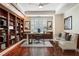 Elegant home office with custom built-in bookshelves, wood floors and lots of natural light at 2881 Peachtree Ne Rd # 704, Atlanta, GA 30305