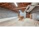 Unfinished basement with block wall and exposed utilities at 357 Forest Lake Rd, Lawrenceville, GA 30046