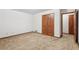 Bedroom with carpeted floors, a double door closet and a doorway, offering ample storage at 357 Forest Lake Rd, Lawrenceville, GA 30046