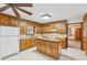 Functional kitchen with wooden cabinets and a center island at 357 Forest Lake Rd, Lawrenceville, GA 30046