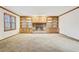 Charming living room featuring a brick fireplace with built-in shelving and natural light at 357 Forest Lake Rd, Lawrenceville, GA 30046
