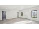 Spacious finished basement with wood-look floors, white trim, and natural light from the windows at 4013 Brenteresa Ct, Snellville, GA 30039