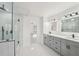 Beautiful bathroom with dual sinks, quartz counters, and a frameless glass shower at 4013 Brenteresa Ct, Snellville, GA 30039
