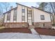 Beautiful two-story home featuring a stone base, modern siding, and expansive windows at 4013 Brenteresa Ct, Snellville, GA 30039