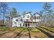 An exterior side view of the house and backyard featuring a deck and screened-in porch at 4013 Brenteresa Ct, Snellville, GA 30039