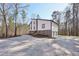 Contemporary home with a large driveway, stone accents, and attached garage at 4013 Brenteresa Ct, Snellville, GA 30039
