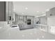 Modern kitchen with grey cabinets, black hardware, stainless steel appliances, marble backsplash, quartz countertops and recessed lighting at 4013 Brenteresa Ct, Snellville, GA 30039