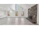 Bright living room with vaulted ceilings, stone fireplace, and large windows at 4013 Brenteresa Ct, Snellville, GA 30039