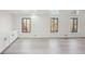 Bright living room featuring large windows and built-in storage cabinets at 4013 Brenteresa Ct, Snellville, GA 30039