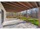 The patio has a concrete floor with a wood plank ceiling with backyard view at 4013 Brenteresa Ct, Snellville, GA 30039