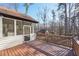 A screened-in porch that has access to the backyard, surrounded by trees at 4013 Brenteresa Ct, Snellville, GA 30039