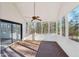 Spacious sunroom with ceiling fan and lots of windows for enjoying natural light and outdoor views at 4013 Brenteresa Ct, Snellville, GA 30039