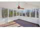 Inviting sunroom with wood floors and large windows offering tranquil wooded views at 4013 Brenteresa Ct, Snellville, GA 30039