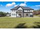 Spacious backyard with covered patio and expansive lawn at 1011 Nours Cir, Lawrenceville, GA 30045