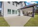 Large backyard with covered patio, spacious concrete pad, and green grass at 1011 Nours Cir, Lawrenceville, GA 30045