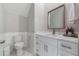 Well-lit bathroom featuring a modern vanity with countertop, stylish mirror, and updated fixtures at 1011 Nours Cir, Lawrenceville, GA 30045