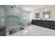 Bathroom featuring a glass shower, soaking tub, and a dual sink vanity at 1011 Nours Cir, Lawrenceville, GA 30045