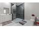 Modern bathroom featuring a glass-enclosed shower, white vanity, and sleek design at 1011 Nours Cir, Lawrenceville, GA 30045