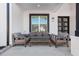 Relaxing covered porch with comfortable seating and a view of the front yard at 1011 Nours Cir, Lawrenceville, GA 30045