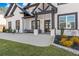 Beautiful home featuring a covered porch, manicured lawn and landscape, and a modern-style exterior at 1011 Nours Cir, Lawrenceville, GA 30045