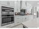 Modern kitchen with stainless steel appliances and white cabinets at 1011 Nours Cir, Lawrenceville, GA 30045