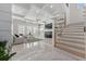 Bright living room with coffered ceiling, fireplace, built-in shelving and marble floors at 1011 Nours Cir, Lawrenceville, GA 30045