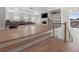 Cozy living room with a fireplace, built-in shelving, and staircase with metal railings at 1011 Nours Cir, Lawrenceville, GA 30045