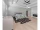 Main bedroom featuring a tray ceiling, hardwood floors, and fireplace at 1011 Nours Cir, Lawrenceville, GA 30045