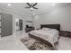 Spacious main bedroom with an open doorway to an ensuite bathroom and large windows at 1011 Nours Cir, Lawrenceville, GA 30045
