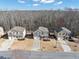 Aerial view of the neighborhood showcasing well-maintained homes, mature trees, and community layout at 5160 Bucknell Trce, Cumming, GA 30028