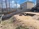 Spacious backyard with a fire pit area and seating, perfect for outdoor gatherings and relaxation at 5160 Bucknell Trce, Cumming, GA 30028