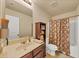 Full bathroom featuring a vanity, toilet and shower-tub combination with patterned curtain at 5160 Bucknell Trce, Cumming, GA 30028