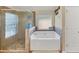 The primary bathroom features a separate shower and soaking tub at 5160 Bucknell Trce, Cumming, GA 30028
