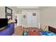 Cozy bedroom featuring a tray ceiling, double doors and a large window for natural light at 5160 Bucknell Trce, Cumming, GA 30028