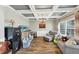 Inviting living room with coffered ceilings, hardwood floors, and a cozy seating area by the window at 5160 Bucknell Trce, Cumming, GA 30028