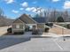 Stone pool house with gated entrance to the community pool on a sunny day at 5160 Bucknell Trce, Cumming, GA 30028