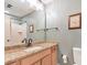 Bathroom with a granite vanity and framed mirror, plus a shower and toilet at 66 Goldrush Ne Cir, Atlanta, GA 30328