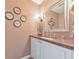 Powder room featuring a wood countertop and stylish wall decor at 66 Goldrush Ne Cir, Atlanta, GA 30328