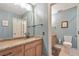 Traditional bathroom with a framed mirror, oak vanity, and neutral wall color at 66 Goldrush Ne Cir, Atlanta, GA 30328