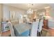 Dining room with a chandelier, buffet, and large mirror, adjacent to the kitchen view at 66 Goldrush Ne Cir, Atlanta, GA 30328
