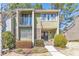 Charming two-story townhome with a balcony and well-maintained landscaping at 66 Goldrush Ne Cir, Atlanta, GA 30328