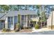 Well-maintained two-story townhouse features a private balcony, stone accents, and reserved parking at 66 Goldrush Ne Cir, Atlanta, GA 30328