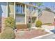 Charming townhouse with a cozy front porch, stone accents, and well-maintained landscaping at 66 Goldrush Ne Cir, Atlanta, GA 30328